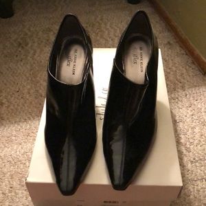 Never worn black leather boots.